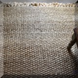 D02. Woven natural sisal rug. Measures approx 8'3” x 10'6” 